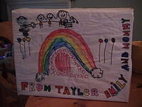 Side 1: note Dad, Taylor, Emily, Mom & new baby (and crib)